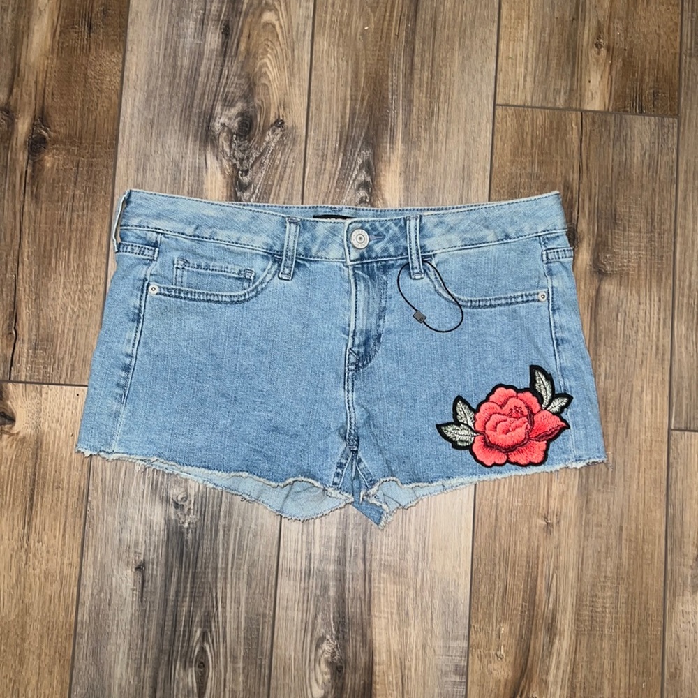 Express jean shorts with flower patch